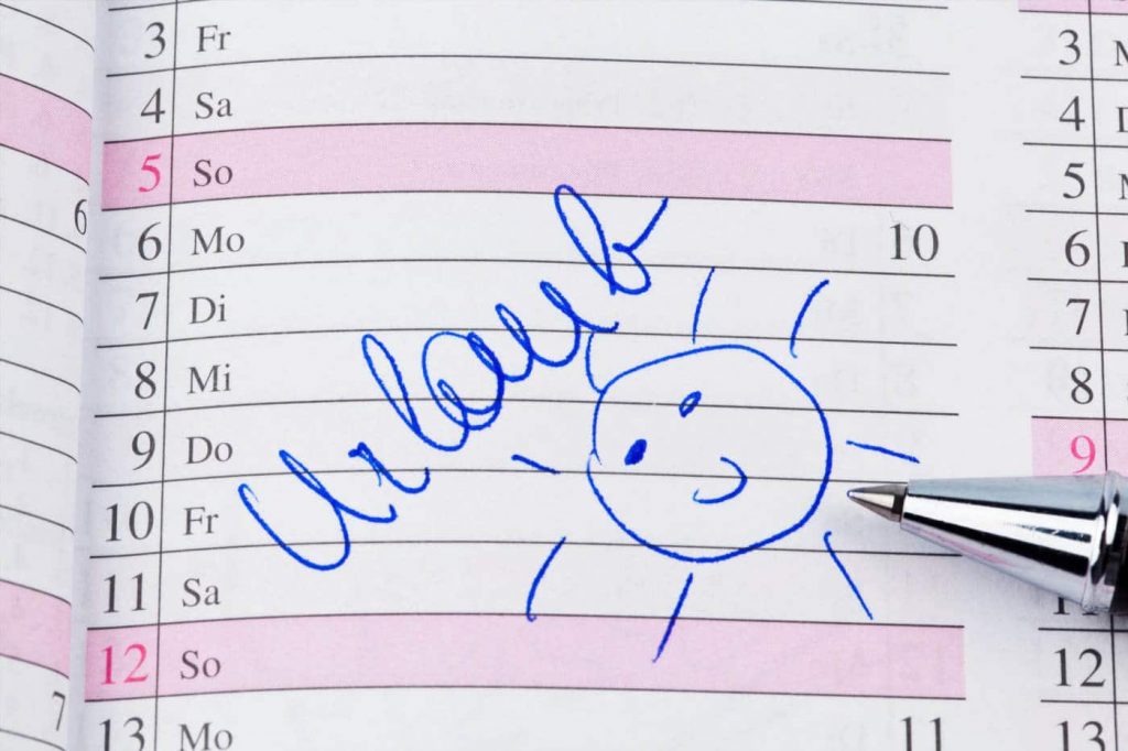 Kalender mit Eintrag Urlaub